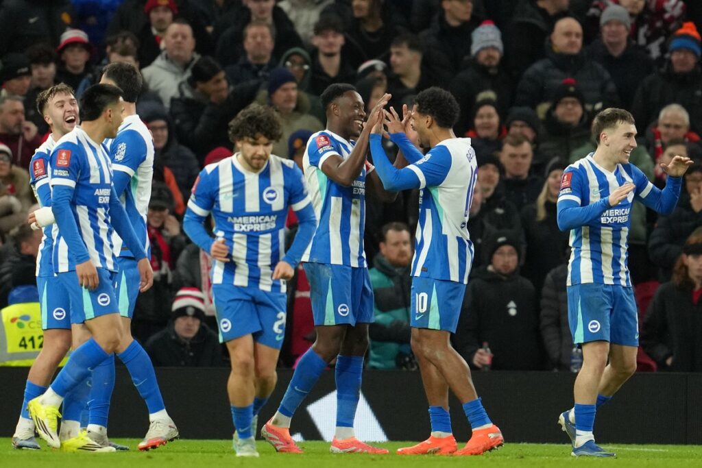 Brighton players celebrate a goal during the FA Cup third round soccer match between Manchester United and Brighton in Manchester, England, Sunday, Jan. 11, 2026. (AP Photo/Jon Super)