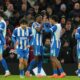 Brighton players celebrate a goal during the FA Cup third round soccer match between Manchester United and Brighton in Manchester, England, Sunday, Jan. 11, 2026. (AP Photo/Jon Super)