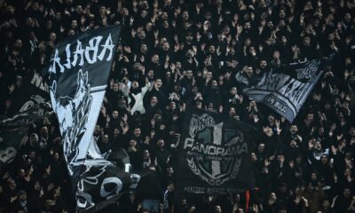 PAOK's fans wave giant flags of their team during the Europa League soccer match between PAOK and Real Betis in Thessaloniki, Greece, Thursday, Jan. 22, 2026. (AP Photo/Giannis Papanikos)