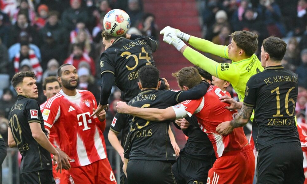 Augsburg's goalkeeper Finn Dahmen in action during the German Bundesliga soccer match between Bayern Munich and FC Augsburg in Munich, Saturday, Jan. 24, 2026. (Peter Kneffel/dpa via AP)