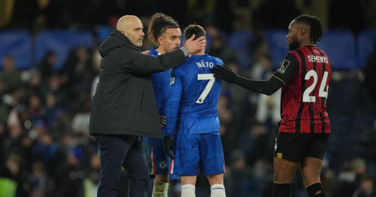 Chelsea's head coach Enzo Maresca, left, Chelsea's Pedro Neto (7) and Bournemouth's Antoine Semenyo (24) stand on the pitch after the English Premier League soccer match between Chelsea and Bournemouth in London, England, Tuesday, Dec. 30, 2025. (AP Photo/Kin Cheung)
