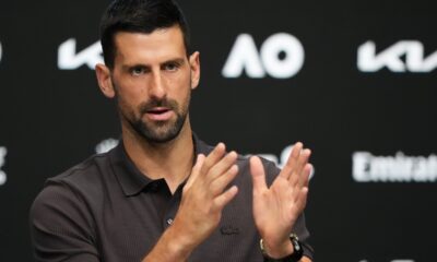 Novak Djokovic of Serbia gestures during a press conference ahead of the Australian Open tennis championship in Melbourne, Australia, Saturday, Jan. 17, 2026. (AP Photo/Aaron Favila)