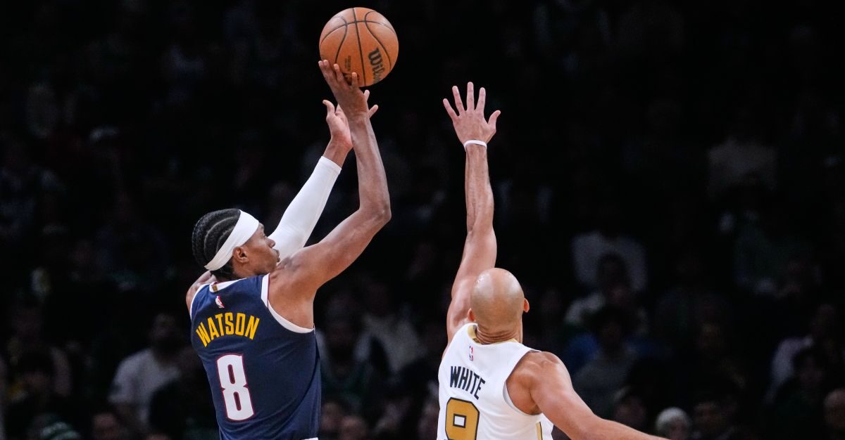 Denver Nuggets guard Peyton Watson (8) shoots over Boston Celtics guard Derrick White (9) during the second half of an NBA basketball game, Wednesday, Jan. 7, 2026, in Boston. (AP Photo/Charles Krupa)