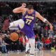 Los Angeles Lakers guard Luka Doncic plays with the basketball during the second half of an NBA game against the Chicago Bulls in Chicago, Monday, Jan. 26, 2026. (AP Photo/Nam Y. Huh)