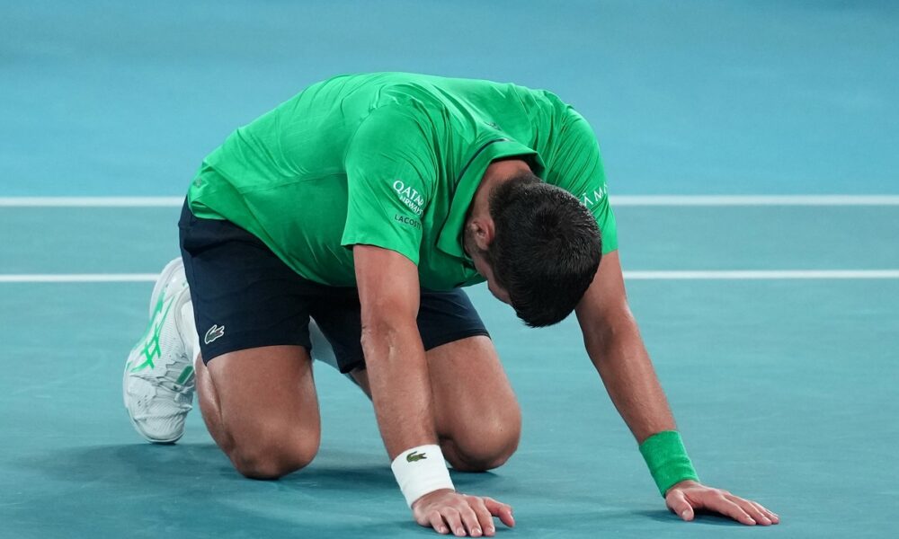 Novak Djokovic of Serbia reacts after defeating Jannik Sinner of Italy in their semifinal match at the Australian Open tennis championship in Melbourne, Australia, early Saturday, Jan. 31, 2026. (AP Photo/Dita Alangkara)