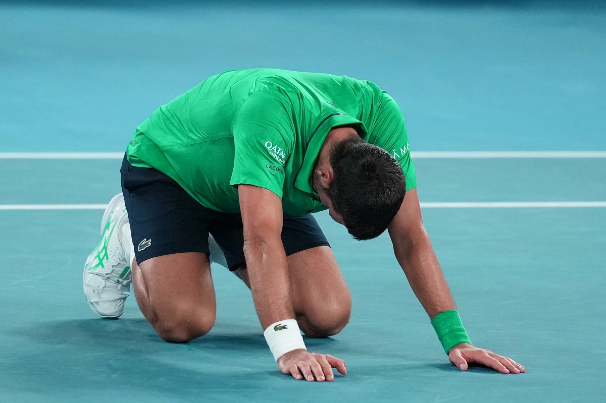 Novak Djokovic of Serbia reacts after defeating Jannik Sinner of Italy in their semifinal match at the Australian Open tennis championship in Melbourne, Australia, early Saturday, Jan. 31, 2026. (AP Photo/Dita Alangkara)