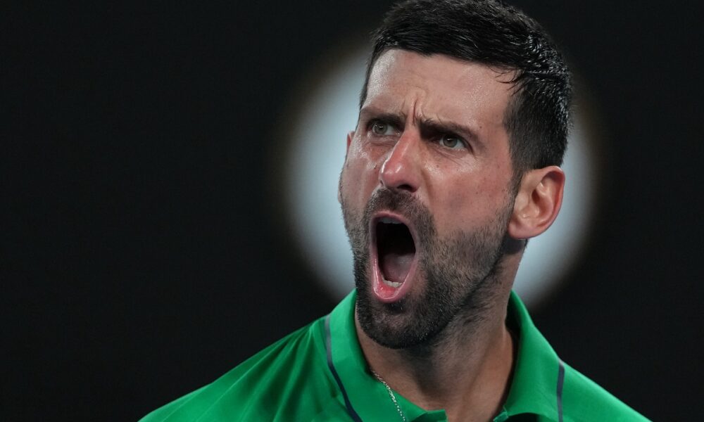Novak Djokovic of Serbia reacts during his semifinal match against Jannik Sinner of Italy at the Australian Open tennis championship in Melbourne, Australia, Saturday, Jan. 31, 2026. (AP Photo/Asanka Brendon Ratnayake)