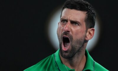Novak Djokovic of Serbia reacts during his semifinal match against Jannik Sinner of Italy at the Australian Open tennis championship in Melbourne, Australia, Saturday, Jan. 31, 2026. (AP Photo/Asanka Brendon Ratnayake)