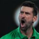 Novak Djokovic of Serbia reacts during his semifinal match against Jannik Sinner of Italy at the Australian Open tennis championship in Melbourne, Australia, Saturday, Jan. 31, 2026. (AP Photo/Asanka Brendon Ratnayake)