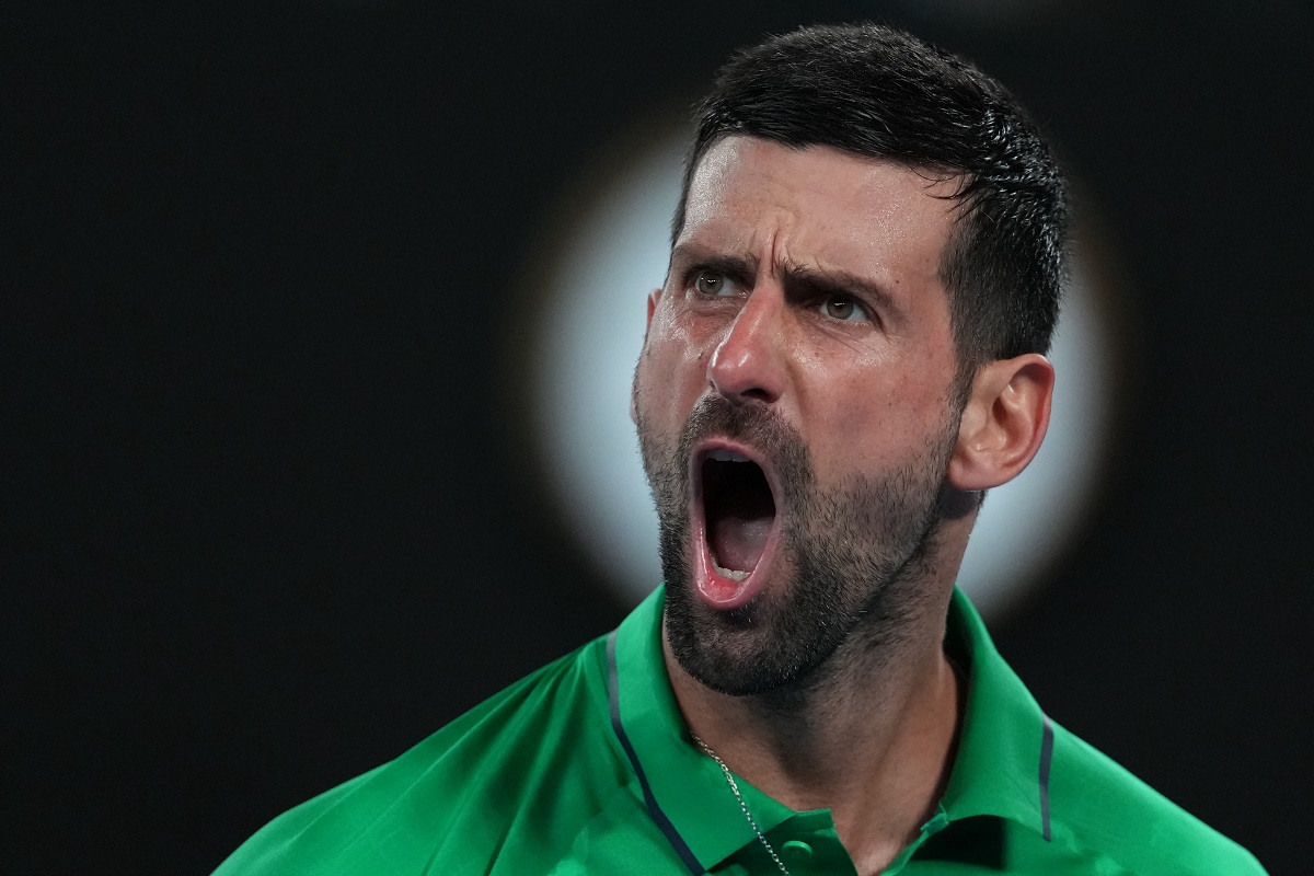 Novak Djokovic of Serbia reacts during his semifinal match against Jannik Sinner of Italy at the Australian Open tennis championship in Melbourne, Australia, Saturday, Jan. 31, 2026. (AP Photo/Asanka Brendon Ratnayake)