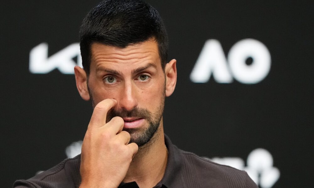Novak Djokovic of Serbia reacts during a press conference ahead of the Australian Open tennis championship in Melbourne, Australia, Saturday, Jan. 17, 2026. (AP Photo/Aaron Favila)