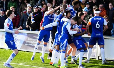 Macclesfield Town's Isaac Buckley-Ricketts celebrates scoring his side's second goal with teammates, during the FA Cup third round soccer match between Macclesfield Town and Crystal Palace, at the Leasing.com Stadium, Macclesfield, England, Saturday, Jan. 10, 2026. (Martin Rickett/PA via AP)