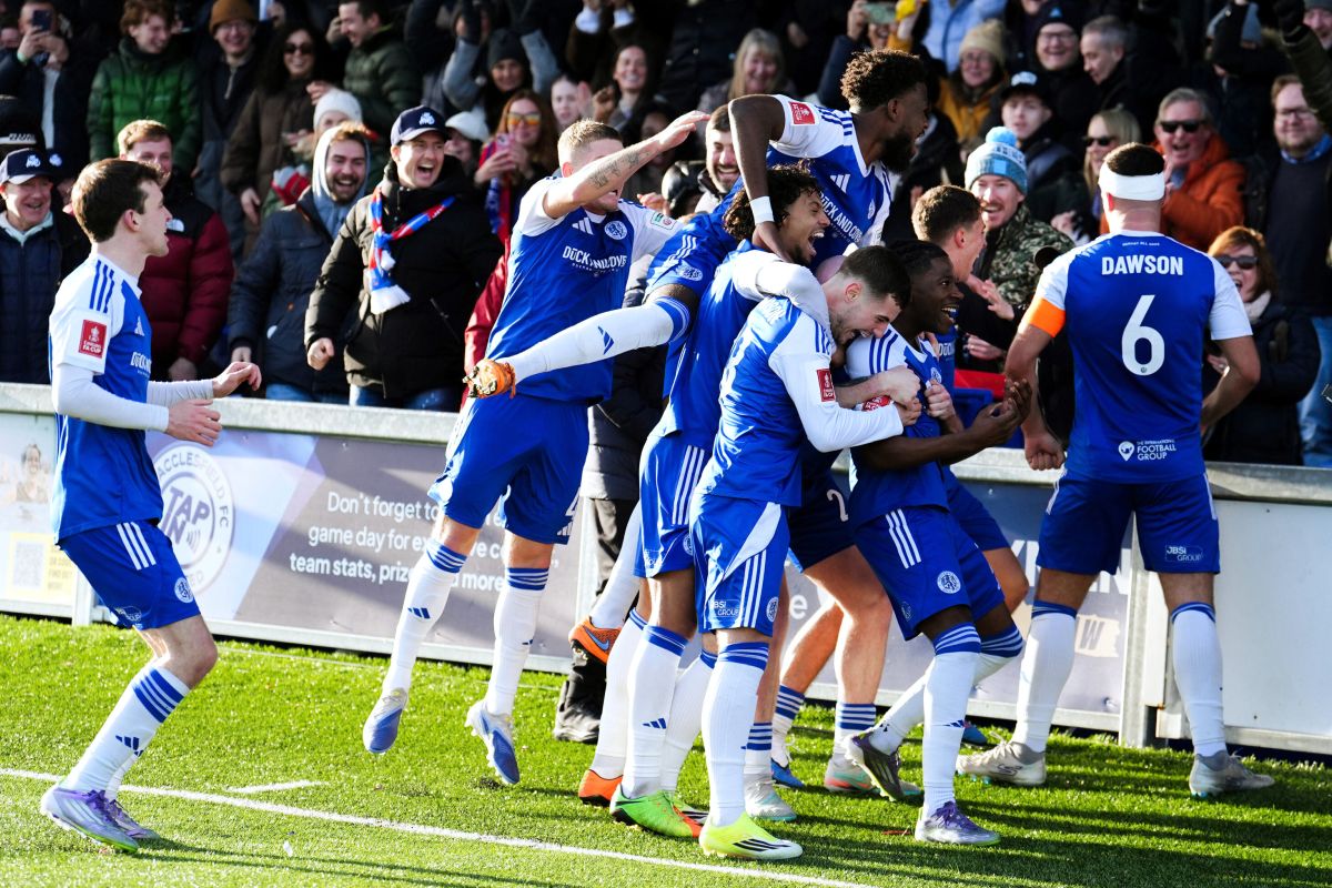Macclesfield Town's Isaac Buckley-Ricketts celebrates scoring his side's second goal with teammates, during the FA Cup third round soccer match between Macclesfield Town and Crystal Palace, at the Leasing.com Stadium, Macclesfield, England, Saturday, Jan. 10, 2026. (Martin Rickett/PA via AP)