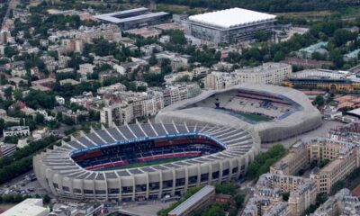 FILE - The Parc des Princes stadium, center, which hosts the Paris Saint-Germain soccer team, and the Jean Bouin stadium, right, which hosts the Paris FC soccer team are seen in Paris, France, Tuesday, July 11, 2023. Atop is the Roland Garros stadium. (AP Photo/Christophe Ena, File)