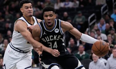 Milwaukee Bucks' Giannis Antetokounmpo (34) tries to get past Denver Nuggets' Spencer Jones during the second half of an NBA basketball game Friday, Jan. 23, 2026, in Milwaukee. (AP Photo/Morry Gash)