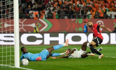 Egypt's Mohamed Salah, right, scores his side's third goal during the Africa Cup of Nations quarterfinal soccer match between Egypt and Ivory Coast, in Agadir, Morocco, Saturday, Jan. 10, 2026. (AP Photo/Mosa'ab Elshamy)