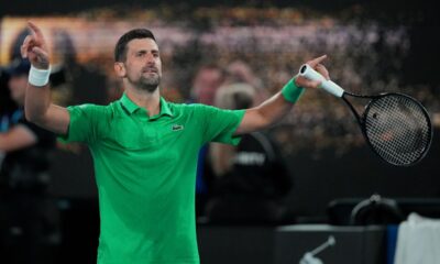 Novak Djokovic of Serbia reacts after defeating Botic van de Zandschulp of the Netherlands in their third round match at the Australian Open tennis championship in Melbourne, Australia, Saturday, Jan. 24, 2026. (AP Photo/Dita Alangkara)