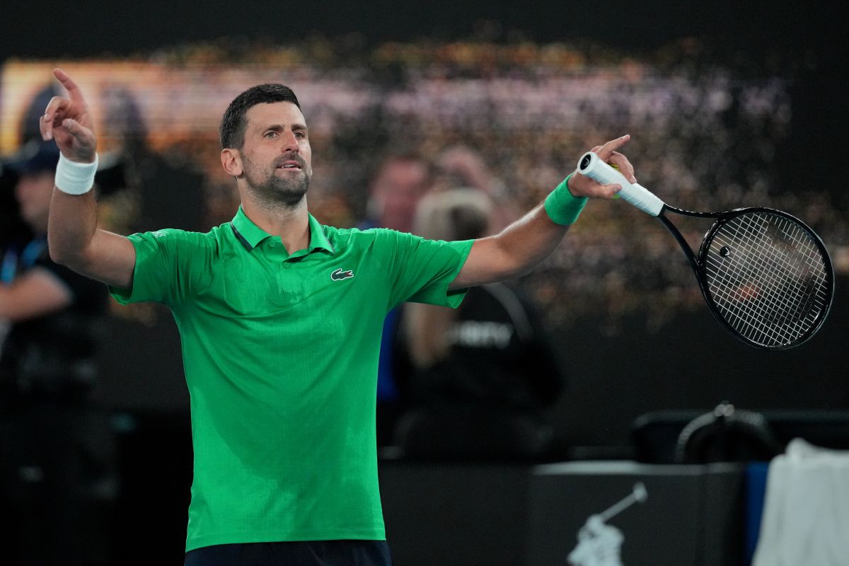 Novak Djokovic of Serbia reacts after defeating Botic van de Zandschulp of the Netherlands in their third round match at the Australian Open tennis championship in Melbourne, Australia, Saturday, Jan. 24, 2026. (AP Photo/Dita Alangkara)