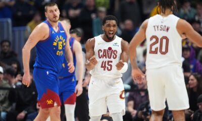 Cleveland Cavaliers guard Donovan Mitchell, center, celebrates with forward Jaylon Tyson, right, after Denver Nuggets center Nikola Jokić misses a last-second, 3-point shot to end an NBA basketball game Monday, Feb. 9, 2026, in Denver. (AP Photo/David Zalubowski)