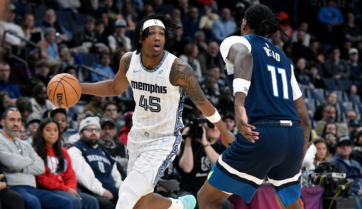 Memphis Grizzlies forward GG Jackson II (45) handles the ball against Minnesota Timberwolves center Naz Reid (11) in the second half of an NBA basketball game Monday, Feb. 2, 2026, in Memphis, Tenn. (AP Photo/Brandon Dill)