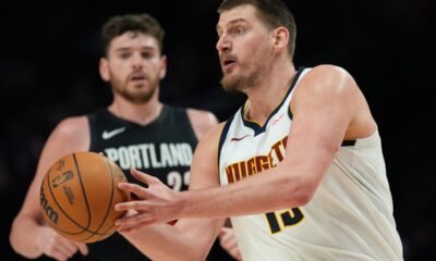 Denver Nuggets center Nikola Jokić looks to pass the ball during the second half of an NBA basketball game against the Portland Trail Blazers, Friday, Feb. 20, 2026, in Portland, Ore. (AP Photo/Jenny Kane)