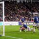 Brentford's Keane Lewis-Potter, bottom center, scores their side's first goal during the English Premier League soccer match between Brentford and Arsenal in London, Thursday, Feb. 12, 2026. (John Walton/PA via AP)
