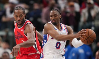 Philadelphia 76ers guard Tyrese Maxey (0) grabs the ball against Los Angeles Clippers forward Kawhi Leonard (2) during the second half of an NBA basketball game Monday, Feb. 2, 2026, in Inglewood, Calif. (AP Photo/Jae C. Hong)