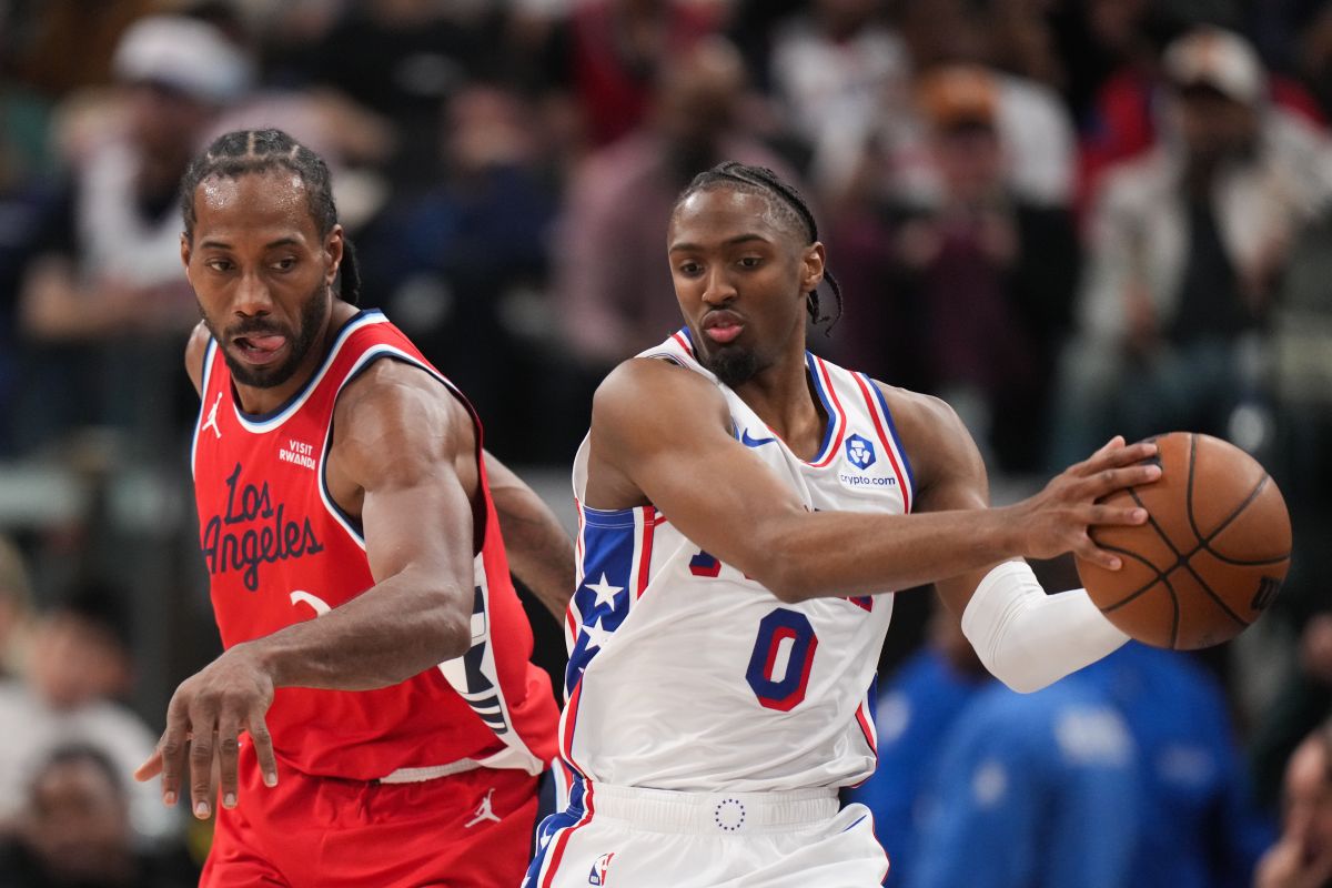 Philadelphia 76ers guard Tyrese Maxey (0) grabs the ball against Los Angeles Clippers forward Kawhi Leonard (2) during the second half of an NBA basketball game Monday, Feb. 2, 2026, in Inglewood, Calif. (AP Photo/Jae C. Hong)