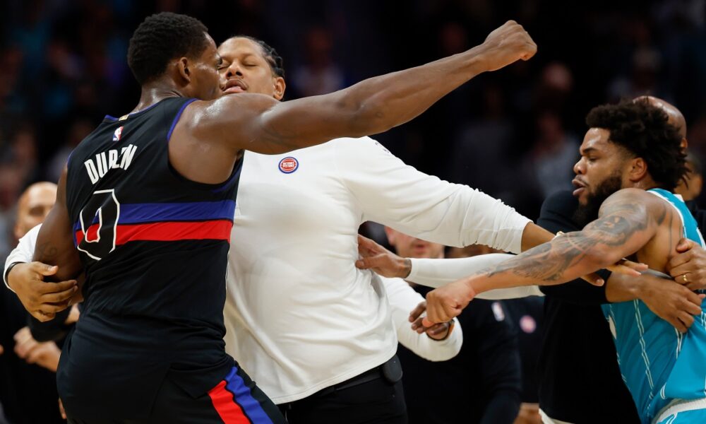 Detroit Pistons center Jalen Duren, left, throws punches with Charlotte Hornets forward Miles Bridges, right, during a fight on the court in the second half of an NBA basketball game in Charlotte, N.C., Monday, Feb. 9, 2026. (AP Photo/Nell Redmond)