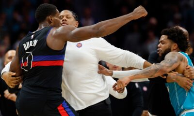 Detroit Pistons center Jalen Duren, left, throws punches with Charlotte Hornets forward Miles Bridges, right, during a fight on the court in the second half of an NBA basketball game in Charlotte, N.C., Monday, Feb. 9, 2026. (AP Photo/Nell Redmond)