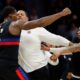 Detroit Pistons center Jalen Duren, left, throws punches with Charlotte Hornets forward Miles Bridges, right, during a fight on the court in the second half of an NBA basketball game in Charlotte, N.C., Monday, Feb. 9, 2026. (AP Photo/Nell Redmond)