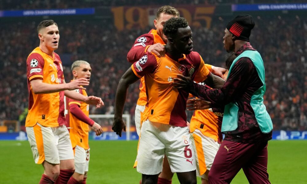Galatasaray's Davinson Sanchez, second right, celebrates with teammates after scoring his side's third goal during a Champions league play-off first leg soccer match between Galatasaray and Juventus, in Istanbul, Turkey, Tuesday, Feb. 17, 2026. (AP Photo/Khalil Hamra)