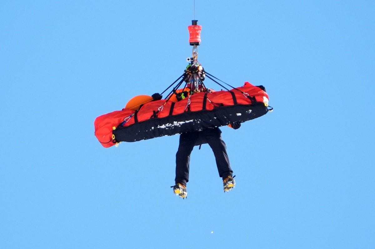 United States' Lindsey Vonn is airlifted away after a crash during an alpine ski women's downhill race, at the 2026 Winter Olympics, in Cortina d'Ampezzo, Italy, Sunday, Feb. 8, 2026. (AP Photo/Jacquelyn Martin)