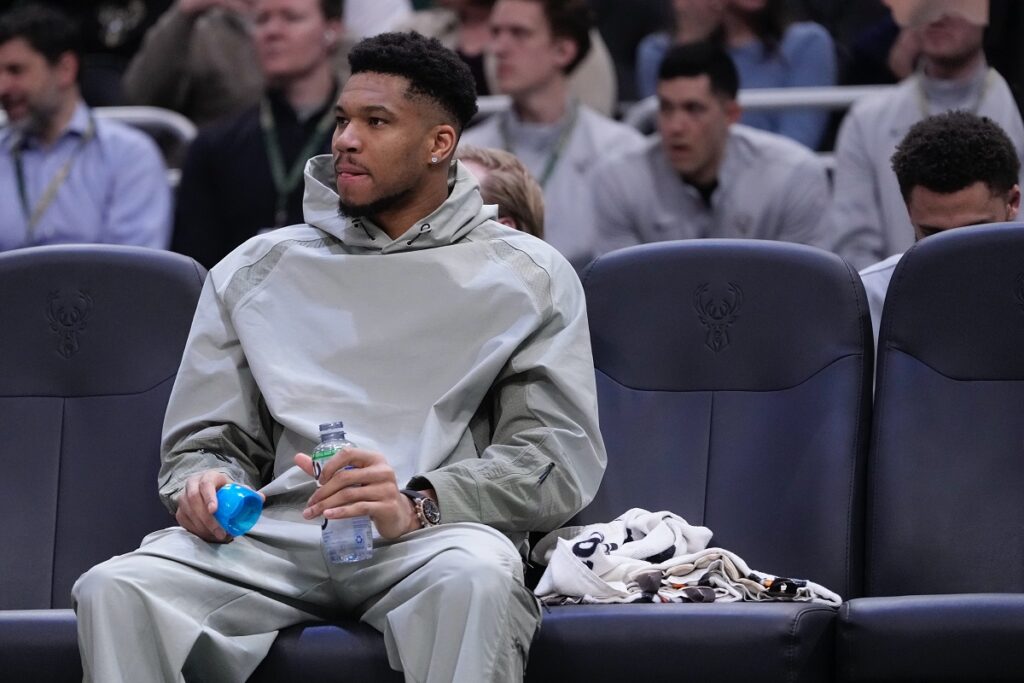 Milwaukee Bucks' Giannis Antetokounmpo watches from the bench during the first half of an NBA basketball game Tuesday, Feb. 3, 2026, in Milwaukee. (AP Photo/Morry Gash)