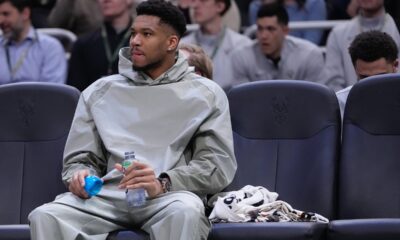 Milwaukee Bucks' Giannis Antetokounmpo watches from the bench during the first half of an NBA basketball game Tuesday, Feb. 3, 2026, in Milwaukee. (AP Photo/Morry Gash)