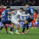 Cremonese's Federico Bonazzoli, center, battles for the ball with Atalanta's Sead Kolasinac, left, and Atalanta's Mario Pasalic during the Italian Serie A soccer match between A.C Atalanta B.C. and Cremoese in Bergamo, Italy, Monday, Feb. 9, 2026. (Stefano Nicoli/LaPresse via AP)