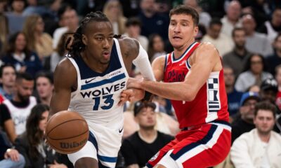 Minnesota Timberwolves guard Ayo Dosunmu, left, drives to the basket as Los Angeles Clippers guard Bogdan Bogdanovic defends during the second half of an NBA basketball game Thursday, Feb. 26, 2026, in Inglewood, Calif. (AP Photo/Kyusung Gong)