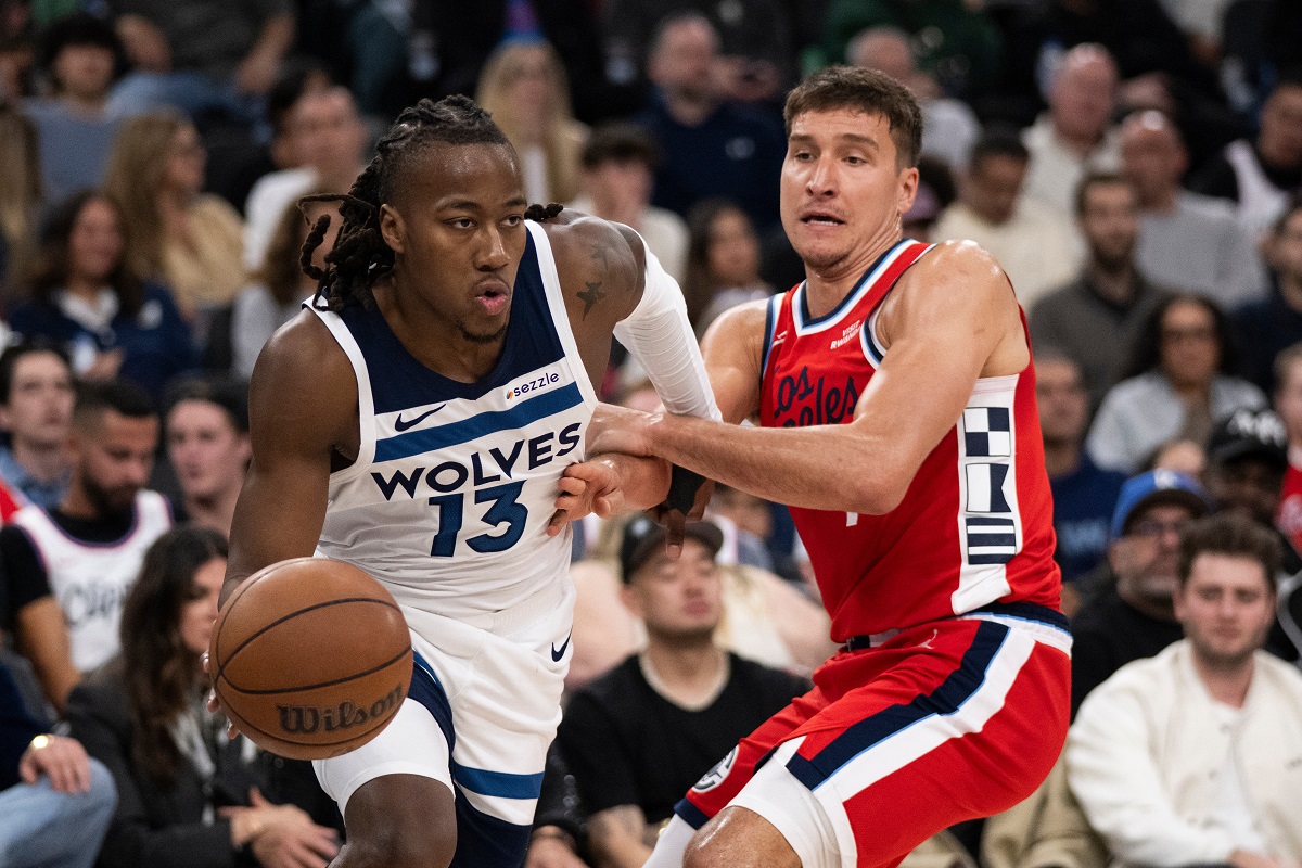 Minnesota Timberwolves guard Ayo Dosunmu, left, drives to the basket as Los Angeles Clippers guard Bogdan Bogdanovic defends during the second half of an NBA basketball game Thursday, Feb. 26, 2026, in Inglewood, Calif. (AP Photo/Kyusung Gong)