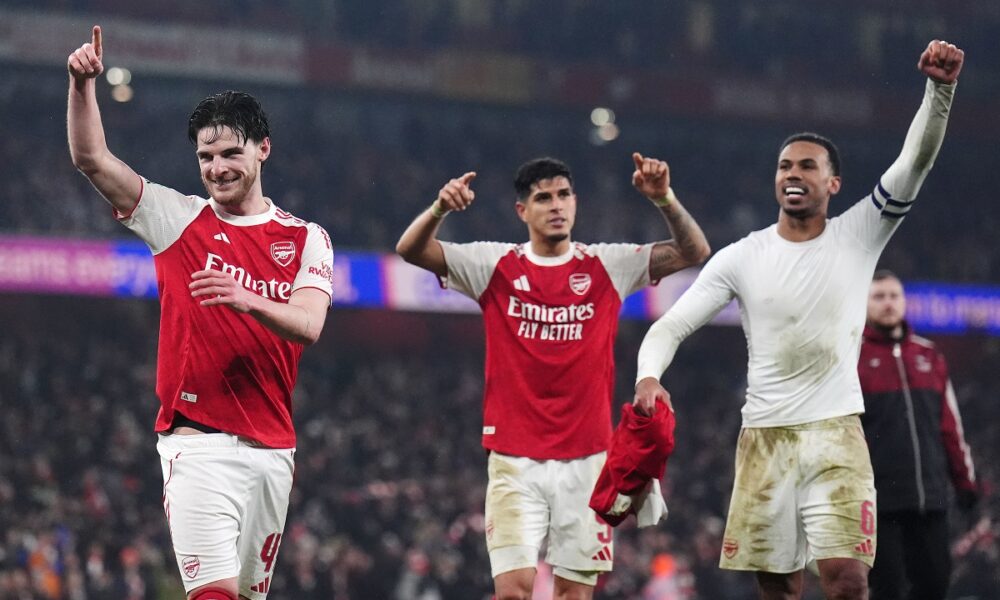 Arsenal players, from left, Declan Rice, Piero Hincapie and Gabriel celebrate after the English League Cup semifinal second leg soccer match between Arsenal and Chelsea in London, Tuesday, Feb. 3, 2026. (John Walton/PA via AP)