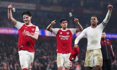 Arsenal players, from left, Declan Rice, Piero Hincapie and Gabriel celebrate after the English League Cup semifinal second leg soccer match between Arsenal and Chelsea in London, Tuesday, Feb. 3, 2026. (John Walton/PA via AP)