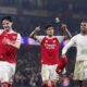 Arsenal players, from left, Declan Rice, Piero Hincapie and Gabriel celebrate after the English League Cup semifinal second leg soccer match between Arsenal and Chelsea in London, Tuesday, Feb. 3, 2026. (John Walton/PA via AP)