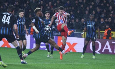 Atletico Madrid's Matteo Ruggeri, centre right, shoots the ball during the Champions League play-off first leg soccer match between Club Brugge and Atletico Madrid, in Bruges, Belgium, Wednesday, Feb. 18, 2026. (AP Photo/Omar Havana)