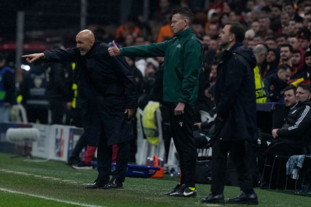 Juventus' head coach Igor Tudor, background, instructs his players during a Champions league play-off first leg soccer match between Galatasaray and Juventus, in Istanbul, Turkey, Tuesday, Feb. 17, 2026. (AP Photo/Khalil Hamra)