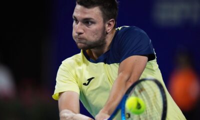 Miomir Kecmanovic of Serbia returns a shot to Terence Atmane of France during a Mexican Open tennis match in Acapulco, Mexico, Thursday, Feb. 26, 2026. (AP Photo/Eduardo Verdugo)