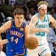 FILE - Oklahoma City Thunder guard Nikola Topic, left, drives the ball upcourt against Charlotte Hornets forward Liam McNeeley, right, during the second half of an NBA basketball preseason game in North Charleston, S.C., Oct. 5, 2025. (AP Photo/Mic Smith, File)