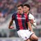 Bologna's Thijs Dallinga, left, fights for the ball with Parma's Alessandro Circati during the Italian Serie A soccer match between Bologna and Parma in Bologna, Italy, Sunday, Feb. 8, 2026. (Massimo Paolone/LaPresse via AP)