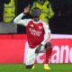 Arsenal's Bukayo Saka celebrates scoring their first goal during the Premier League soccer match between Wolverhampton Wanderers and Arsenal in Wolverhampton, England, Wednesday, Feb. 18, 2026. (Jacob King/PA via AP)