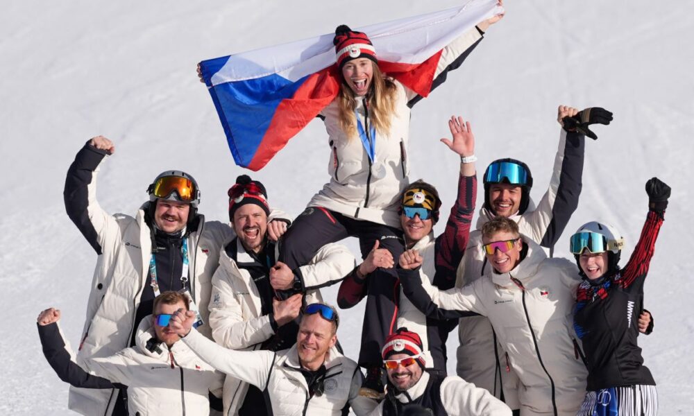 Silver medalist Czechia's Eva Adamczykova celebrates with team members after the women's snowboard cross finals at the 2026 Winter Olympics, in Livigno, Italy, Friday, Feb. 13, 2026. (AP Photo/Lindsey Wasson)