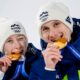 Siblings Nika Prevc, and Domen Prevc, of Slovenia, pose after winning the gold medal in the ski jumping mixed team competition at the 2026 Winter Olympics, in Predazzo, Italy, Tuesday, Feb. 10, 2026. (AP Photo/Matthias Schrader)