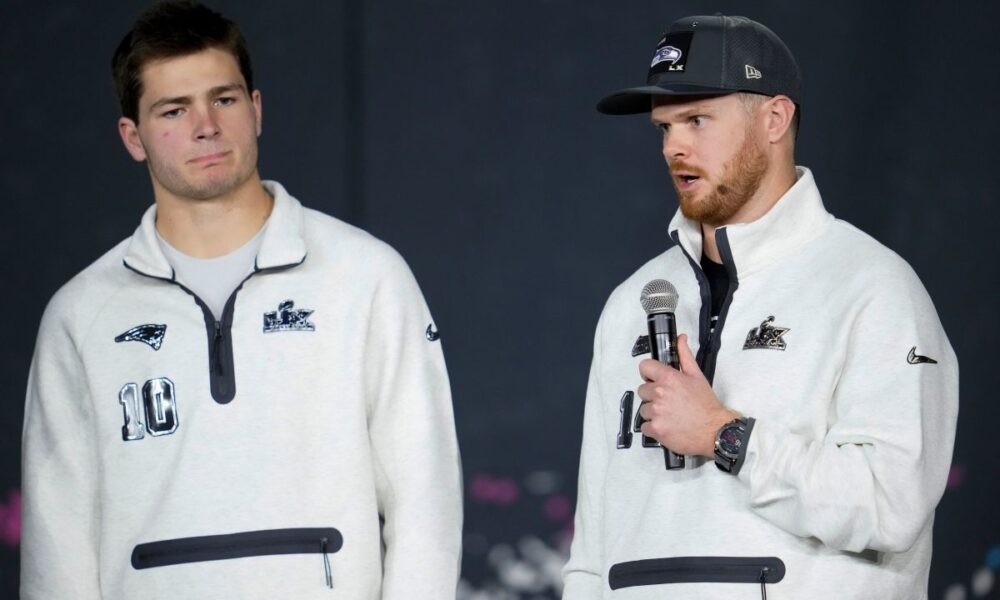 New England Patriots quarterback Drake Maye, left, and Seattle Seahawks quarterback Sam Darnold speak during the NFL Super Bowl Opening Night, Monday, Feb. 2, 2026, in San Jose, Calif. ahead of the Super Bowl 60 football game between the New England Patriots and the Seattle Seahawks. (AP Photo/Godofredo A. Vásquez)